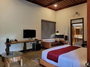 TV a/nebo společenská místnost v ubytování Ananterra Resort Wayanad