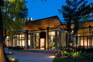 a building with a lot of windows at Treeline Urban Resort in Siem Reap