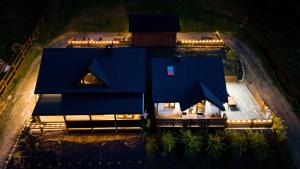 an aerial view of a house with a blue roof at Bieszczadzkie Tarasy in Ustrzyki Dolne