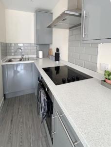 a kitchen with a sink and a counter top at Wellington Road Apartment 4 in Southtown
