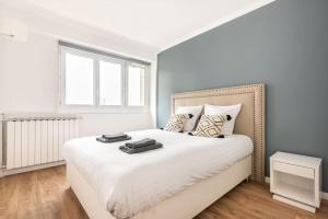 Spacieux et confortable avec vue Tour Eiffel客房内的一张或多张床位