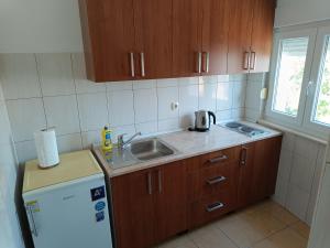 Kuchyň nebo kuchyňský kout v ubytování Studio Apartman Totus Tuus
