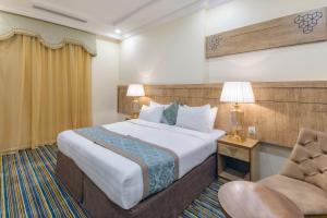 Ένα ή περισσότερα κρεβάτια σε δωμάτιο στο Snood Al Dana Hotel