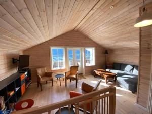 a living room with a bed and a bed and a room with a bedzinski at Hafjell Grenda lejligheder og hytter in Hafjell