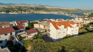 an aerial view of a town with a body of water at Apartments Tanja & Josipa in Pag