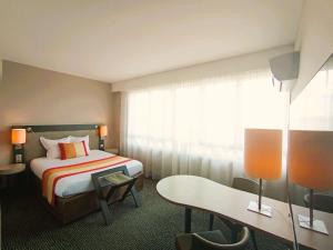 Postel nebo postele na pokoji v ubytování Mercure Limoges Centre