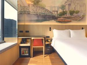 Ibis Singapore on Bencoolen - Newly Renovated客房内的一张或多张床位