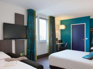 Postel nebo postele na pokoji v ubytování Ibis Styles Lyon Centre - Gare Part Dieu
