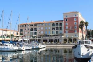 a group of boats are docked in a marina at Appartement Les Terrasses du Port in Port-de-Bouc