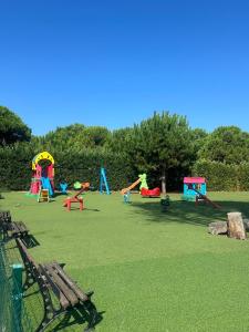 a park with a bunch of colorful playground equipment at YOUR PERFECT SEASIDE Apartment in Draç