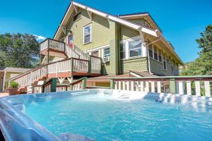 a house with a swimming pool in front of a house at The Avenue Historic Mansion in DT Manitou Springs in Manitou Springs