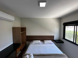 a bedroom with a bed and a window at Pousada Arco Iris Fortaleza in Fortaleza +141 photos