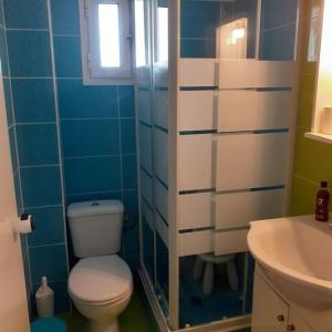 a bathroom with a toilet and a sink at Filippos house in Nea Fokaia in Nea Fokea