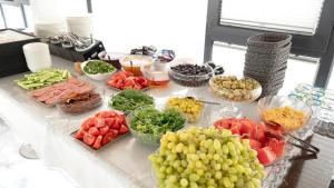 a table topped with lots of different types of fruits and vegetables at Yalıköy Deniz Otel Istanbul in Yalıköy +97 photos