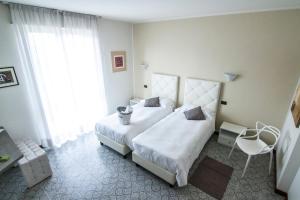 Postel nebo postele na pokoji v ubytování Hotel Le Vigne di Corvino
