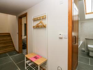 a bathroom with a refrigerator and a toilet at Low Fold Cottage in Penrith +39 photos