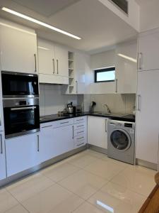 Kuchyň nebo kuchyňský kout v ubytování Lofty-Space