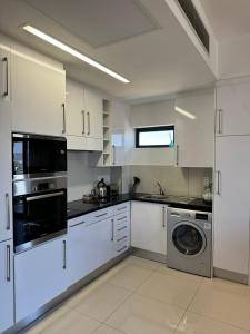 Kuchyň nebo kuchyňský kout v ubytování Lofty-Space