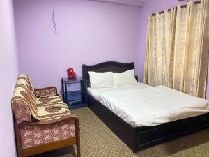 Postel nebo postele na pokoji v ubytování Sanvees Home Stay