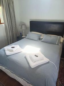 Ένα ή περισσότερα κρεβάτια σε δωμάτιο στο Kingbolt retreat guest house +10 φωτογραφίες