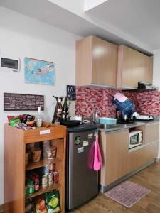 Kuchyň nebo kuchyňský kout v ubytování Lelani's Comfy Condo + 12 fotografií