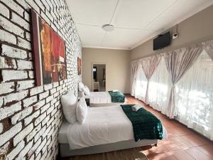 Ένα ή περισσότερα κρεβάτια σε δωμάτιο στο Mar-Zel guesthouse