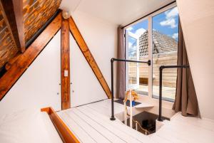 a room with a balcony with a window at The Disco Duck A - city centre Zwolle in Zwolle