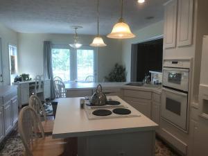 a kitchen with a tea kettle on a stove at Three Springs Plus in Lovingston