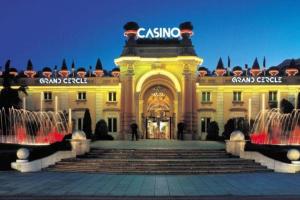 a large yellow building with water fountains in front of it at Joli studio au centre ville in Aix-les-Bains +2 photos