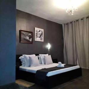 RESIDENCE MGA HOTEL客房内的一张或多张床位