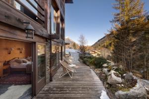 a wooden walkway leading to a bedroom on a house at Studio Cinq Moutons in Orsières