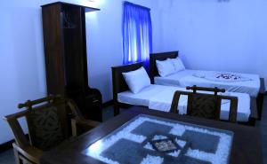 Postel nebo postele na pokoji v ubytování Emerald Coast Hotel Negombo