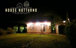 a house notino with lights on it at night at House Notturno in Otočac