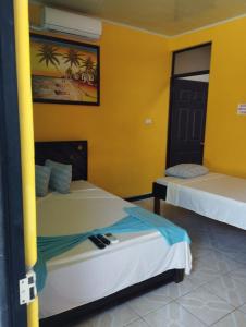 Postel nebo postele na pokoji v ubytování Cabinas Hukats Secret Jungle