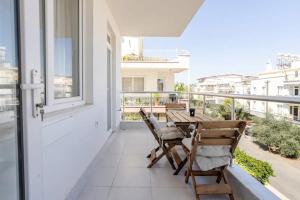 a patio with a table and chairs on a balcony at Sorta Hotel in Antalya