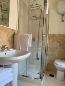 a bathroom with a shower and a sink and a toilet at B&B Pompeii Airfield in Poggiomarino +18 photos