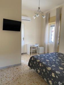 TV a/nebo společenská místnost v ubytování B&B Pompeii Airfield