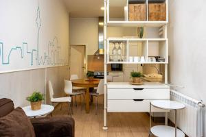 a living room with a kitchen and a dining room at Modern and spacious-2Bedrooms 1Bathroom-Malasaña in Madrid