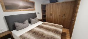 Postel nebo postele na pokoji v ubytování Panorama Chalets am Pass Thurn