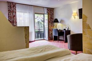 Postel nebo postele na pokoji v ubytování Ringhotel Sonnenhof