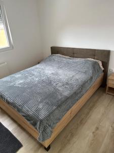 Postel nebo postele na pokoji v ubytování MM Apartman