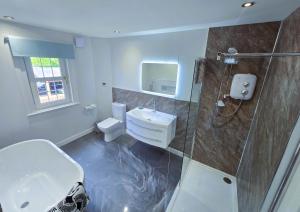 a bathroom with a toilet and a sink and a shower at Ard Veich Estate - Panoramic Highland Sea Views with private beach and woodland in Port Appin +59 photos