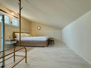 a bedroom with a large bed in a room at Casa di campagna 'Sa Vinzedda' in Galtellì