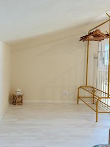 an empty room with a bed and an umbrella at Casa di campagna 'Sa Vinzedda' in Galtellì +32 photos