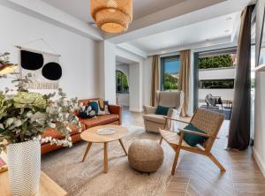 a living room with a couch and chairs and a table at Luxury B.one Apartment in Cavtat