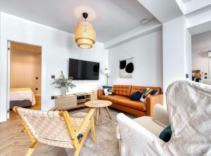 a living room with a couch and a table at Luxury B.one Apartment in Cavtat