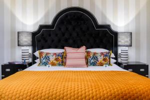 A bed or beds in a room at The Victoria