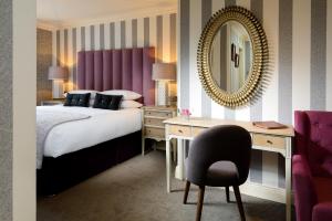 A bed or beds in a room at The Victoria