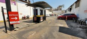 a gas station with a sign on the side of a street at HOTEL TROPICAL in Cuiabá