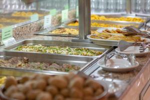 a buffet line with many different types of food at Apartamentos Chinyero in Puerto de la Cruz
